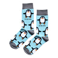 flat lay of sky blue bamboo socks with woven penguin design