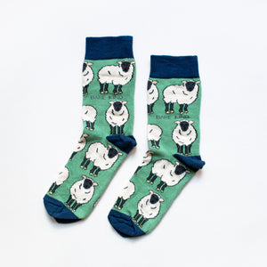 flat lay of green bamboo socks in sheep design