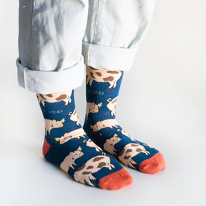 side angle view of standing model wearing bamboo cow socks