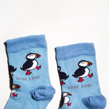 cuff closeup flat lay of blue bamboo puffin socks for kids