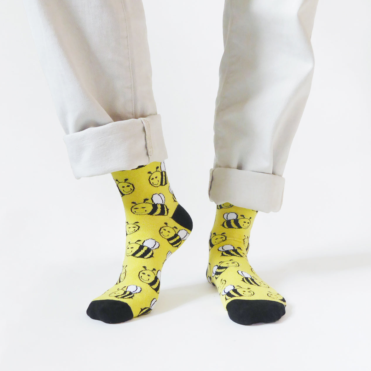 model wearing yellow bamboo socks with bee animal design