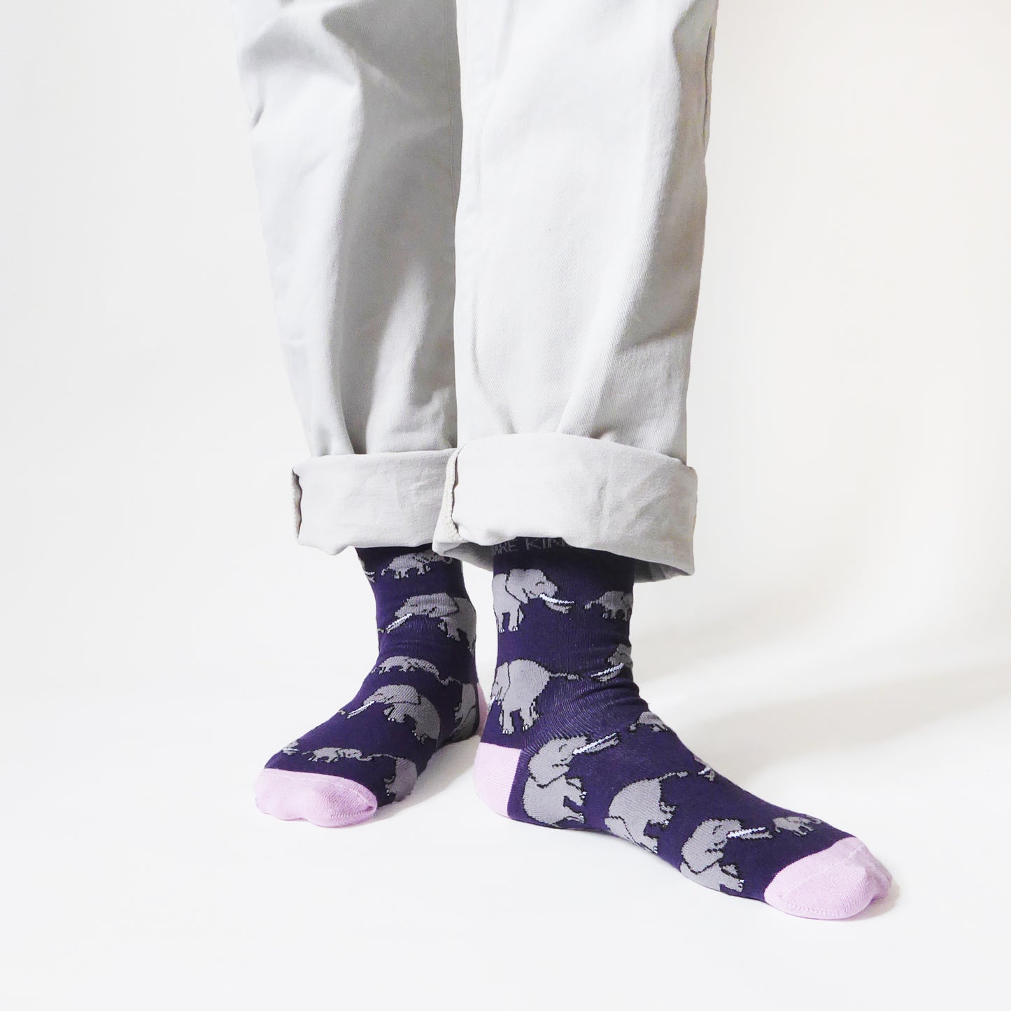 model wearing deep purple bamboo socks with elephant animal design