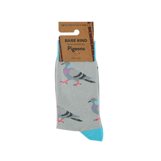 A pair of Bare Kind Pigeons crew socks in light gray, featuring a pattern of colorful pigeons and bright blue toes, shown with their brown cardboard packaging on a white background.