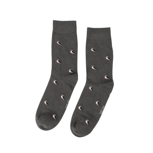 Dark gray socks with small puffin pattern on a white background