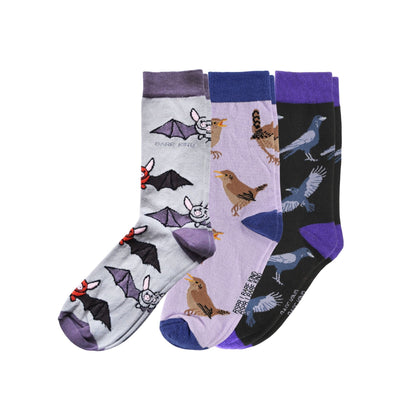 Three pairs of novelty socks displayed together on a white background.