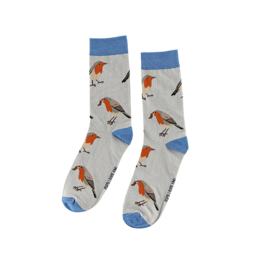 A pair of crew socks with a light gray background featuring a pattern of robin birds and blue accents on the cuffs, heels, and toes.