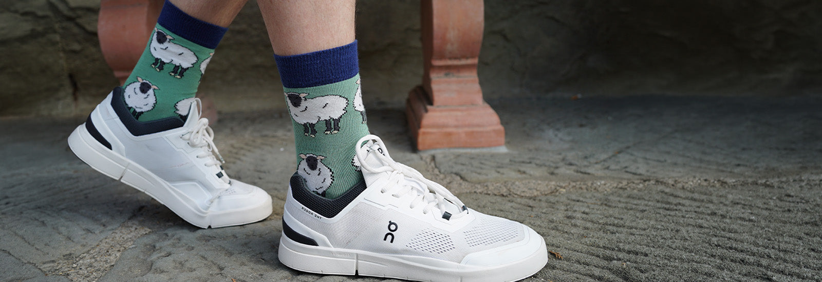 model wearing green sheep bamboo socks