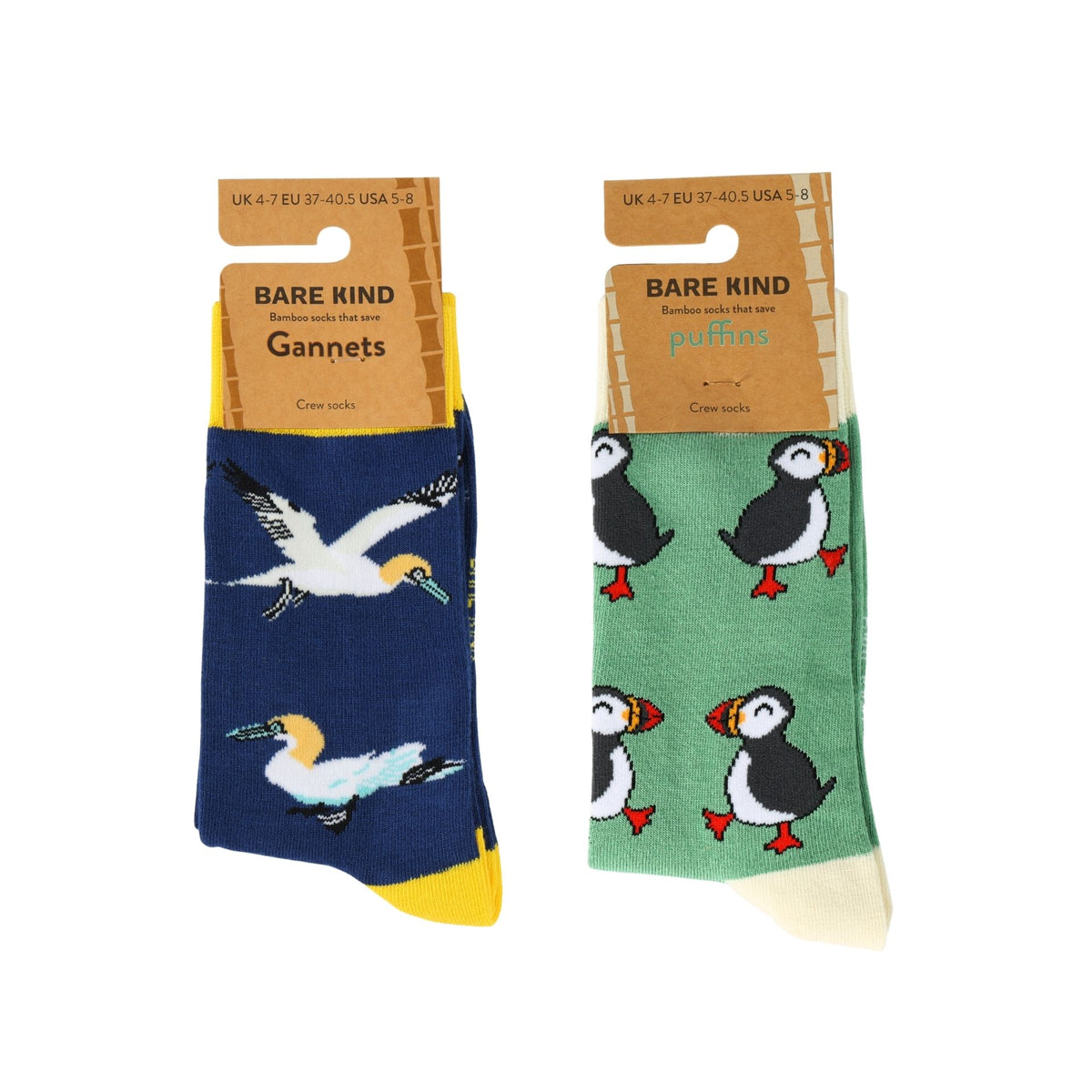 Two pairs of Bare Kind Gannets and puffins crew socks displayed side-by-side on their cardboard hangers against a plain white background.