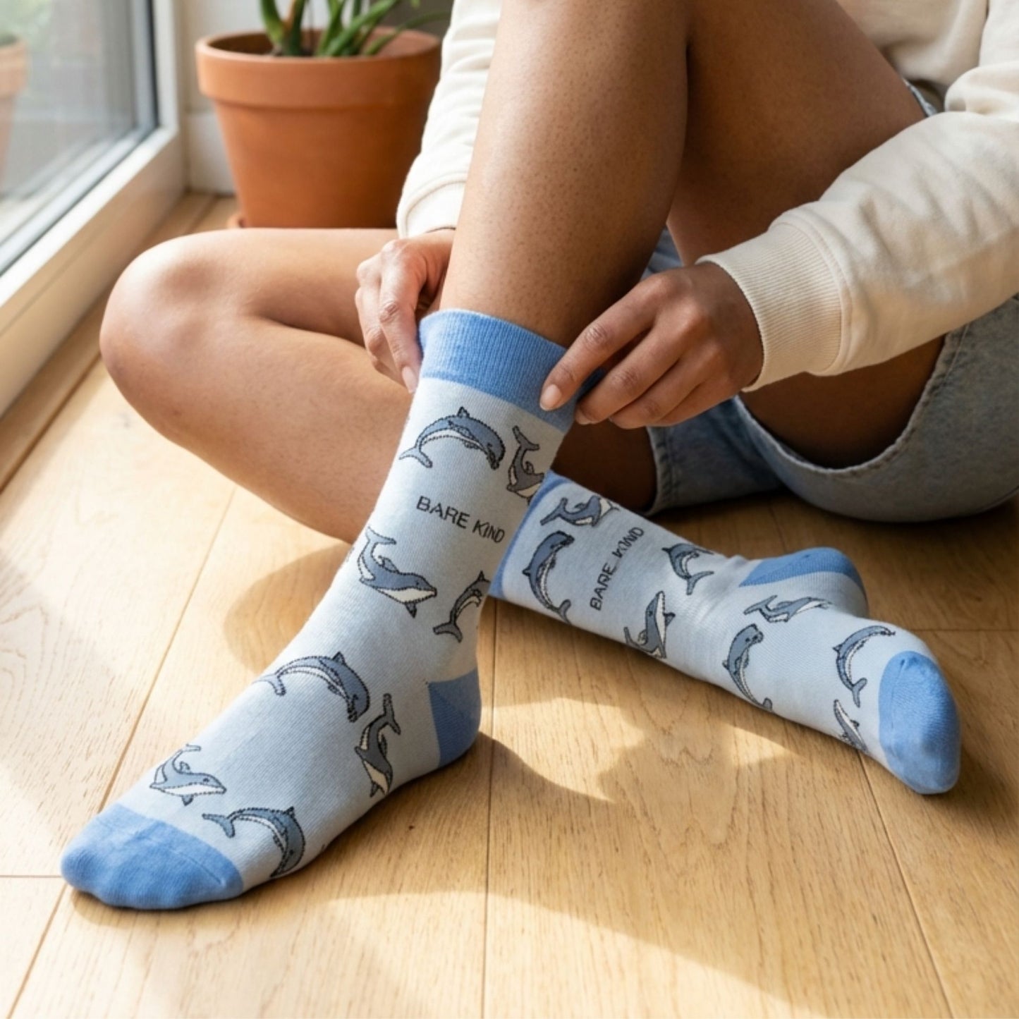 Model wearing dolphin socks
