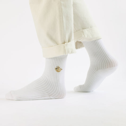 Model wearing white sloth ribbed bamboo socks
