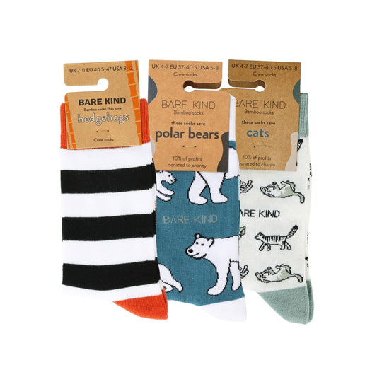 Three pairs of socks with animal-themed designs and 'Bare Kind' packaging on a white background.