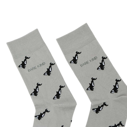 Gray socks with black animal prints and 'Bare Kind' text on a white background