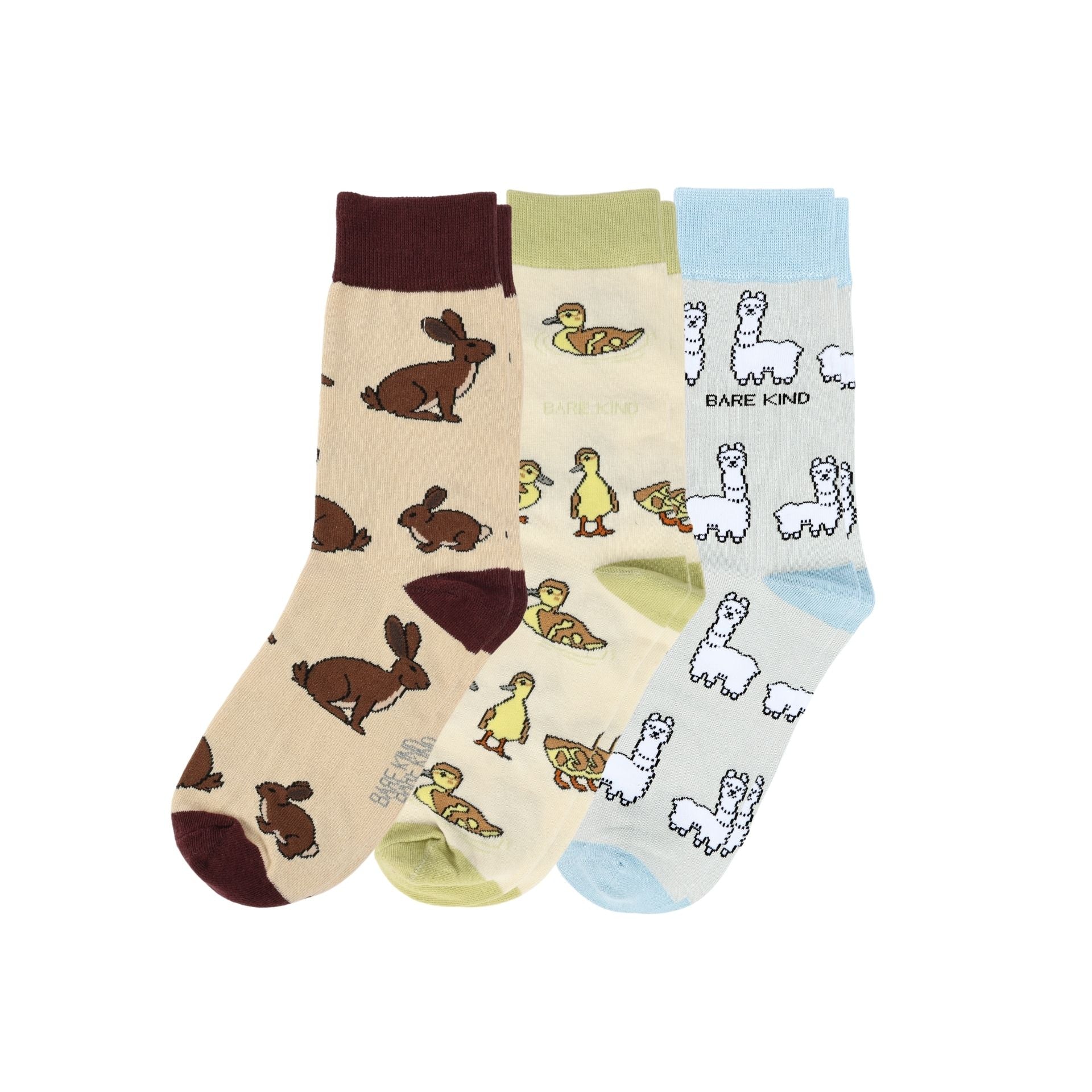 Three pairs of socks with animal patterns on a white background