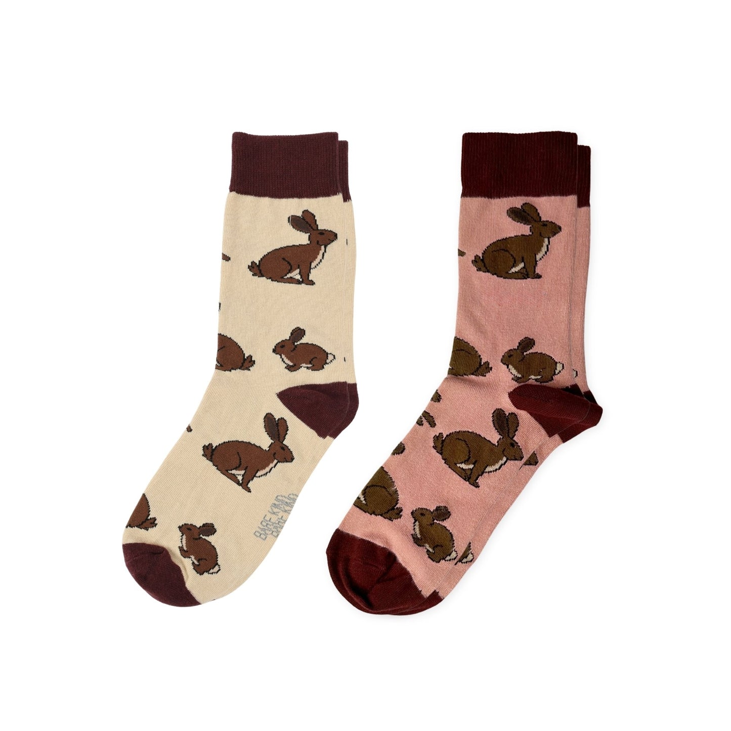 Two pairs of socks with hare pattern on a white background