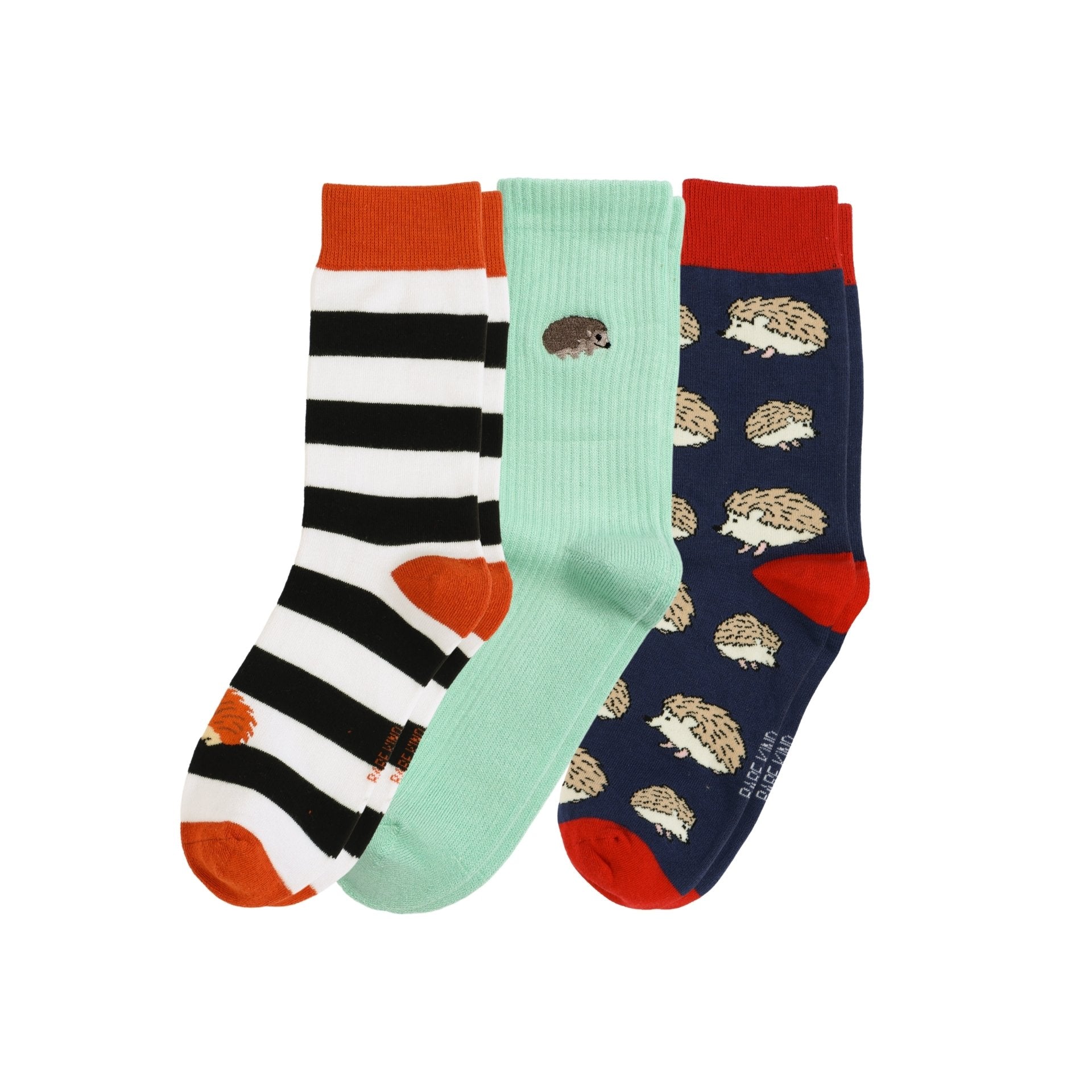 Three pairs of socks with different designs on a white background