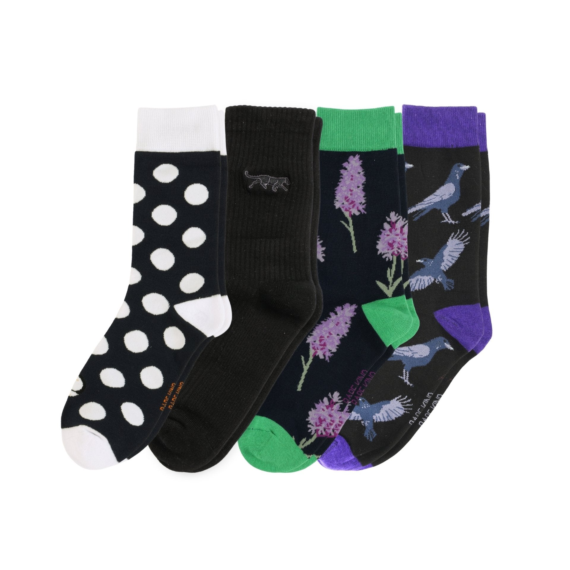 Set of four patterned socks on a white background