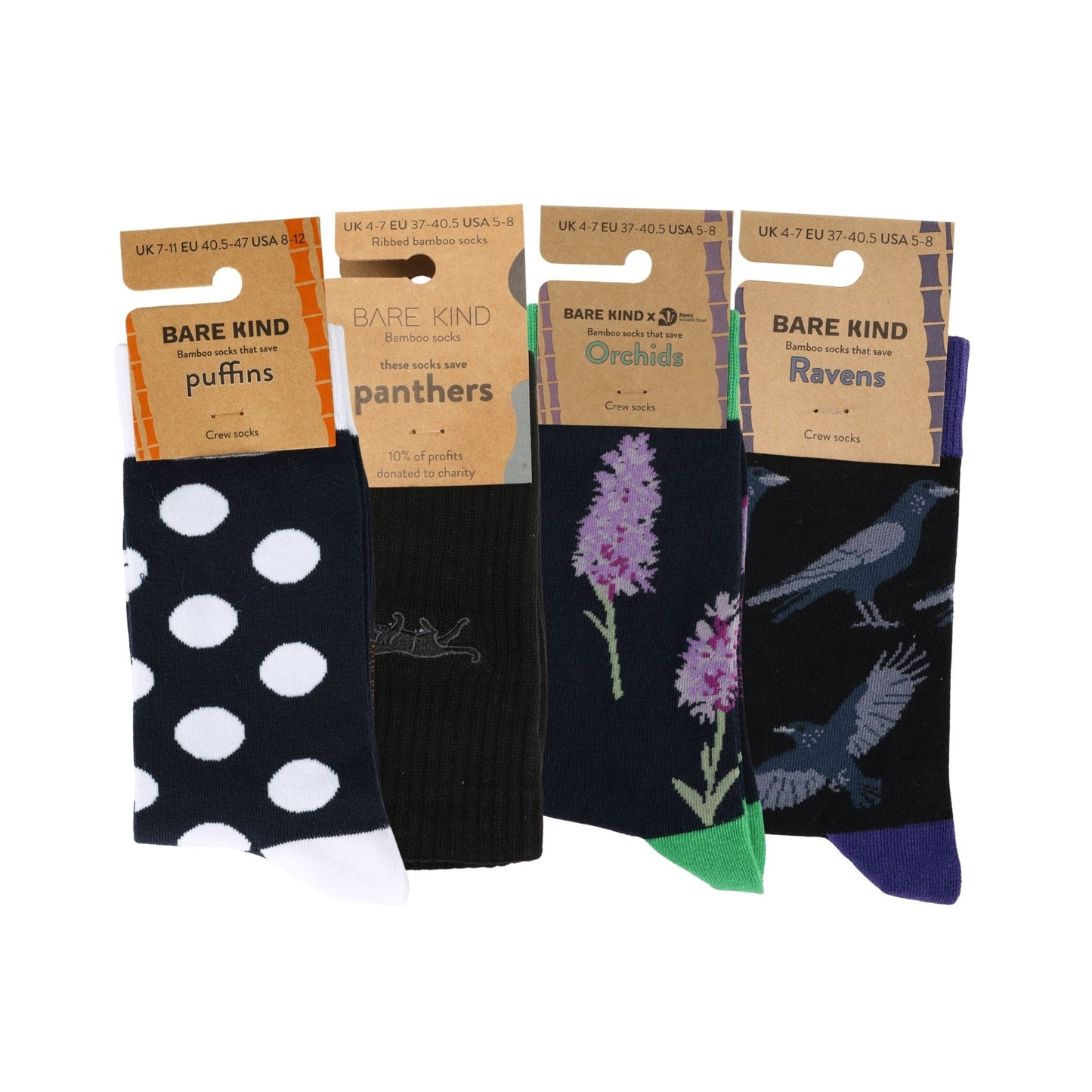 Four pairs of socks with different patterns and designs, each in a separate packaging sleeve.