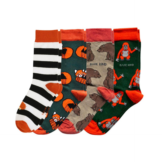 Set of four pairs of socks with animal designs on a white background