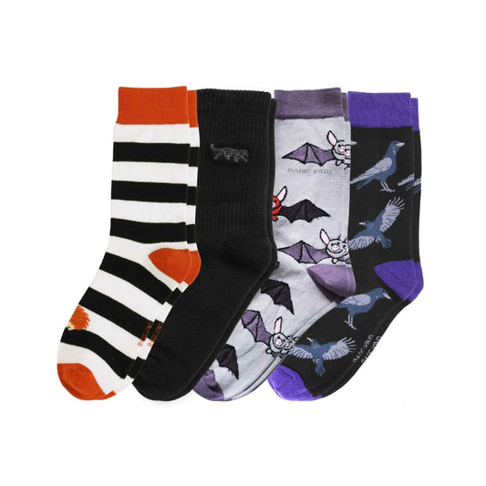 Four pairs of crew socks on a white background. The designs include black and white stripes with orange accents, solid black, light gray with bats, and dark gray with ravens and purple accents.