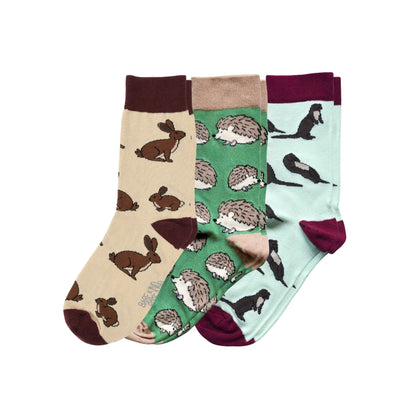 Set of three socks with animal patterns on a white background
