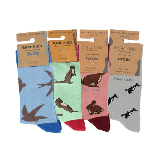 Four pairs of socks with animal designs and 'Bare Kind' packaging on a white background