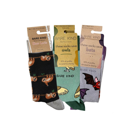 Three pairs of Bare Kind socks with animal-themed packaging on a white background