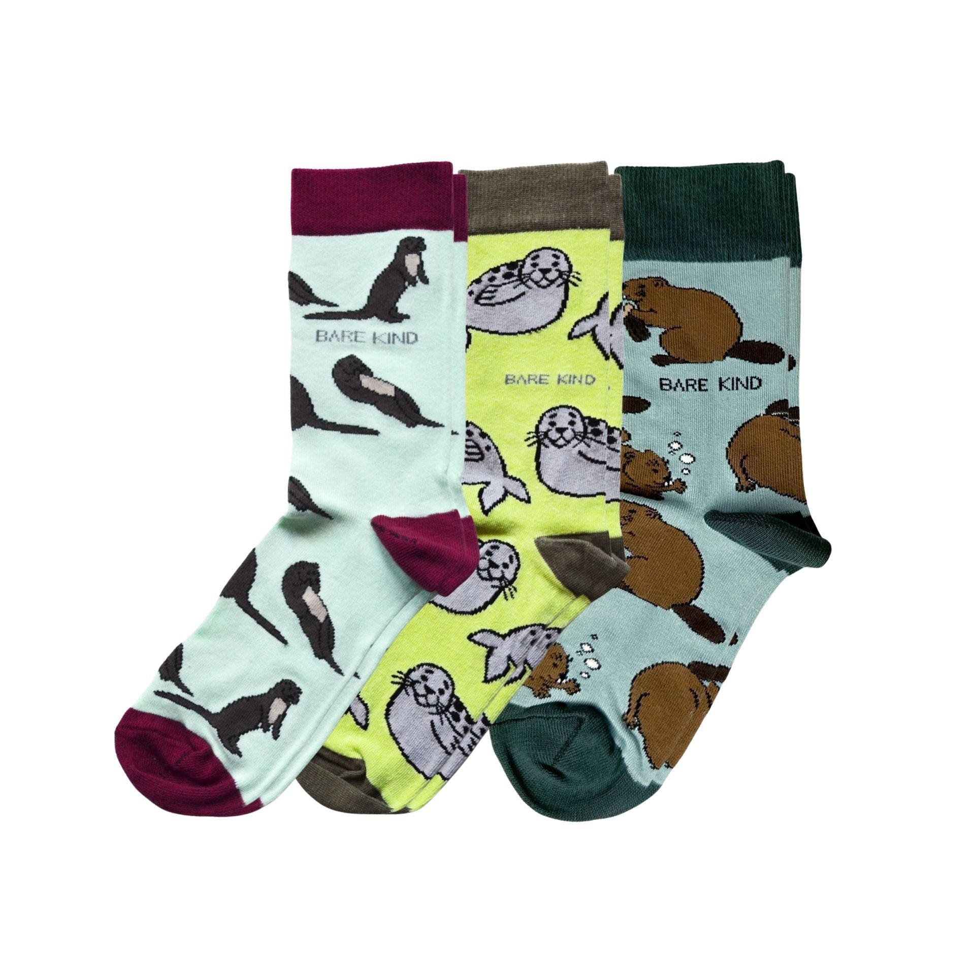 Set of three pairs of socks with animal designs on a white background