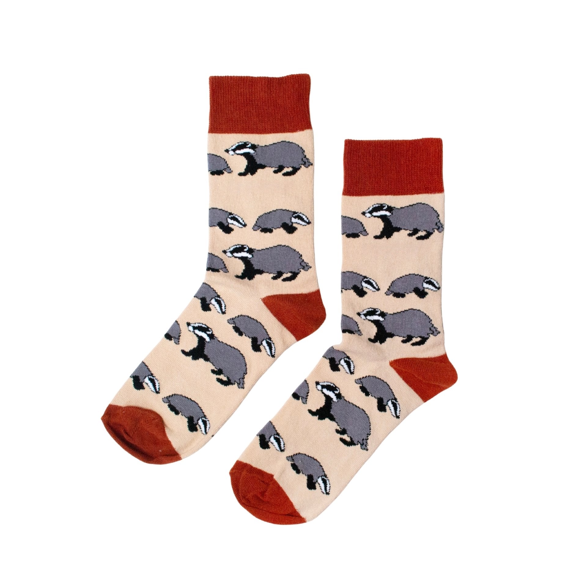 Pair of socks with badger pattern and red accents on a beige background