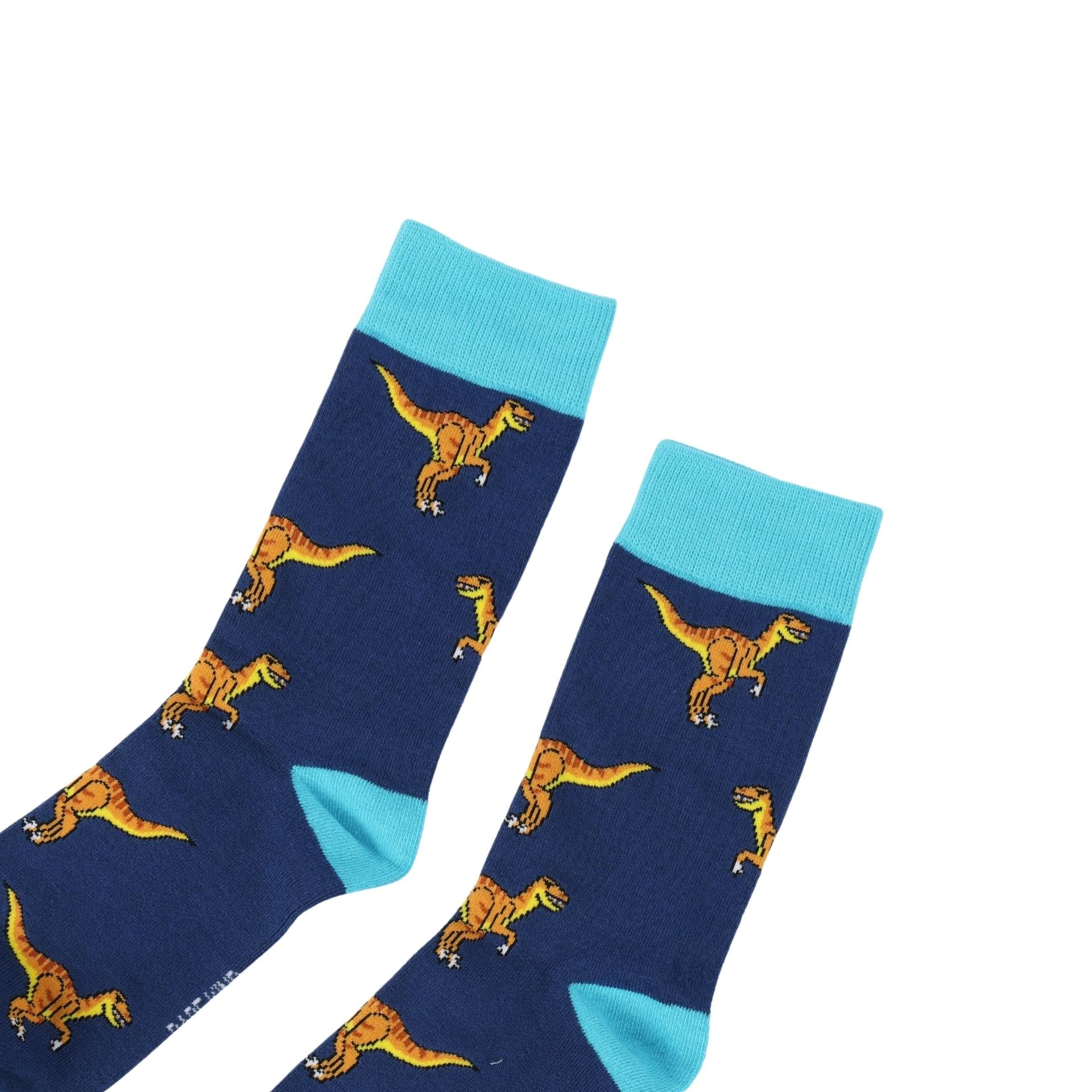 Blue socks with dinosaur pattern and light blue cuffs on a white background