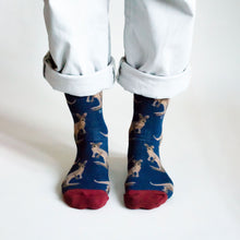 front profile view of standing model wearing dark blue wallaby bamboo socks 