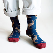 front profile view of standing model wearing dark blue wallaby bamboo socks 