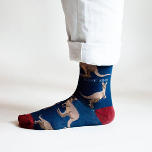 side profile view of standing model wearing dark blue wallaby bamboo socks 