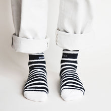 standing model wearing bamboo zebra print socks