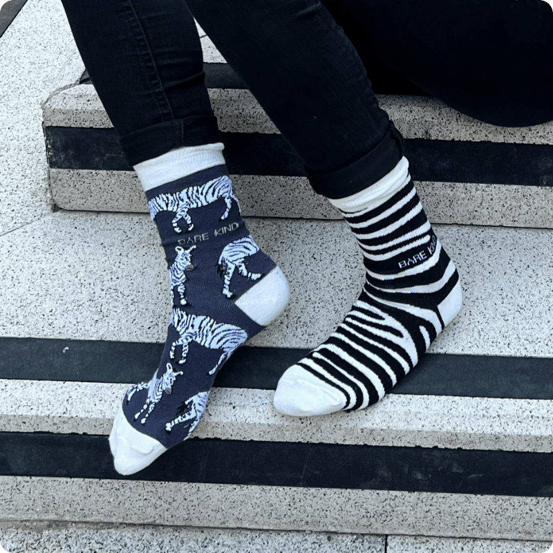 Model wearing zebra and zebra print bamboo socks