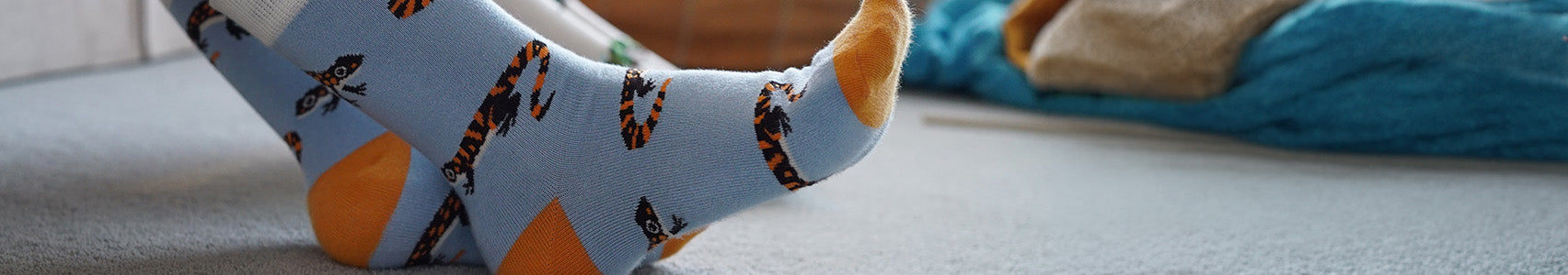 Light blue socks with orange toes and salamander 