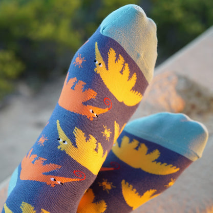 model wearing blue yellow orange anteater bamboo socks