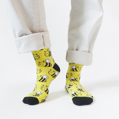 model wearing yellow bee bamboo socks