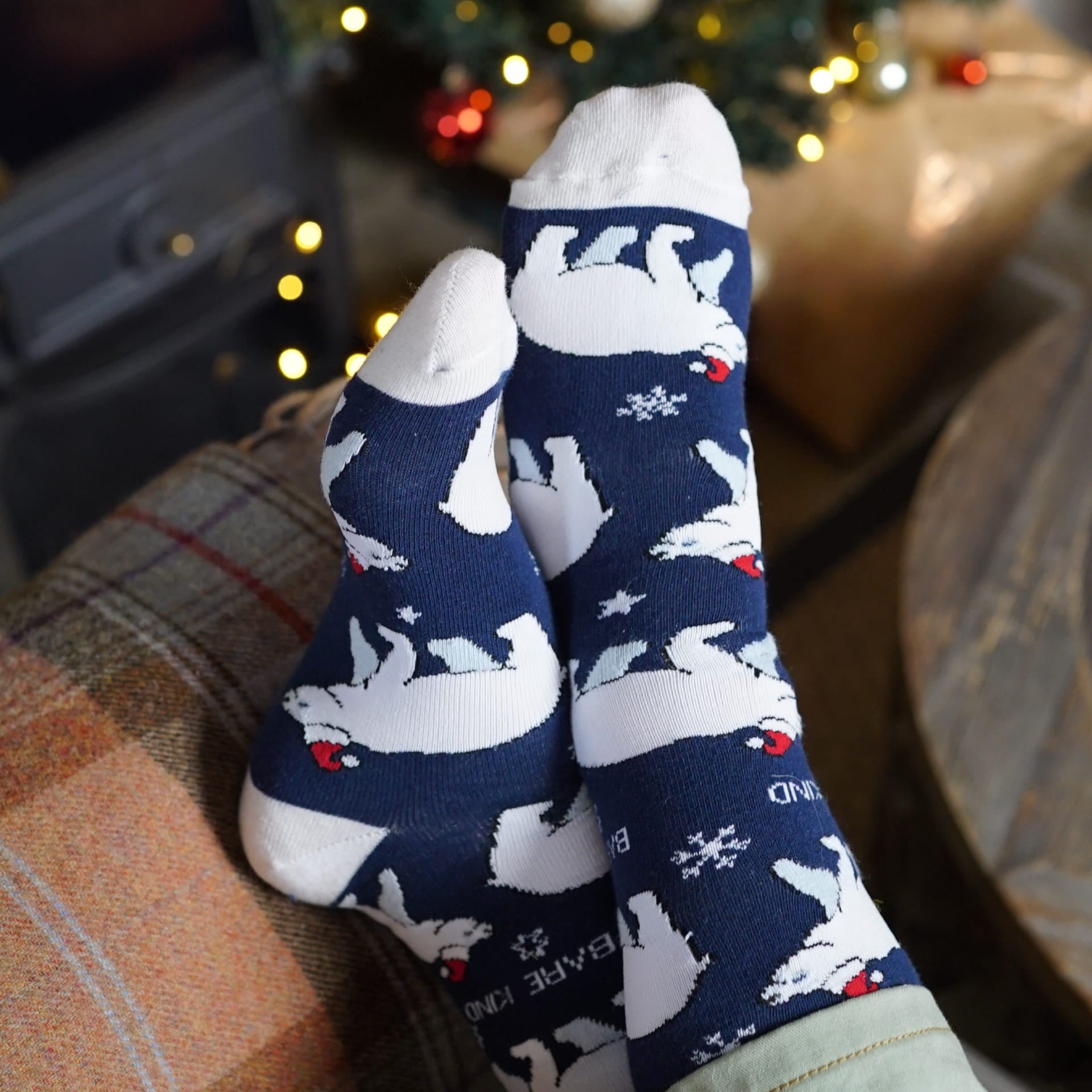 lifestyle image of model wearing blue christmas polar bear bamboo socks