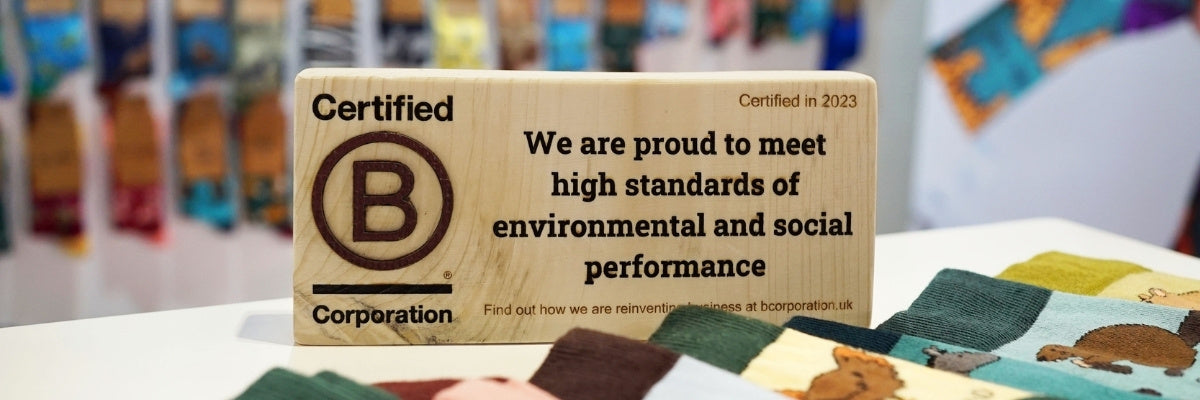 Certified B Corporation sign on a table with a blurred background
