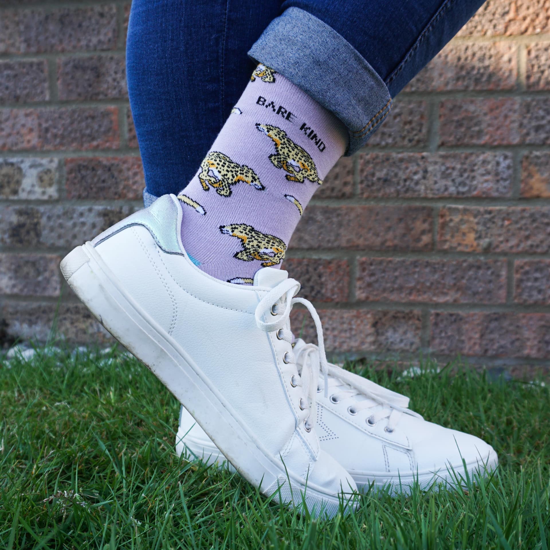 model wearing purple cheetah bamboo socks