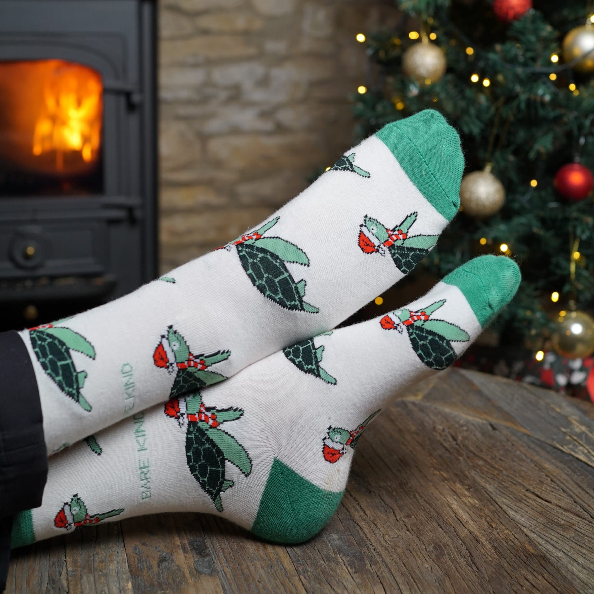 Model wearing christmas turtle bamboo socks