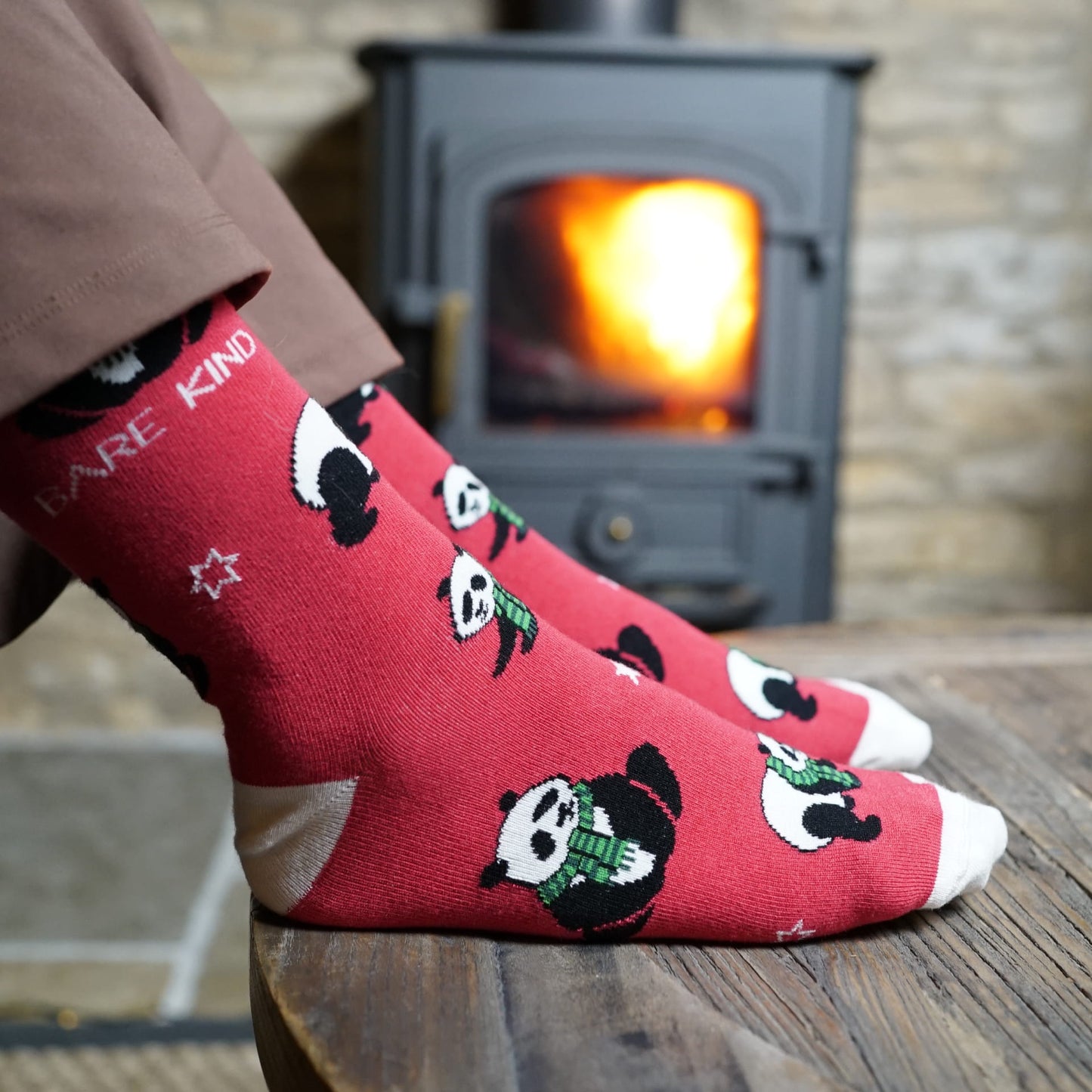 lifestyle image of model wearing red christmas panda bamboo socks