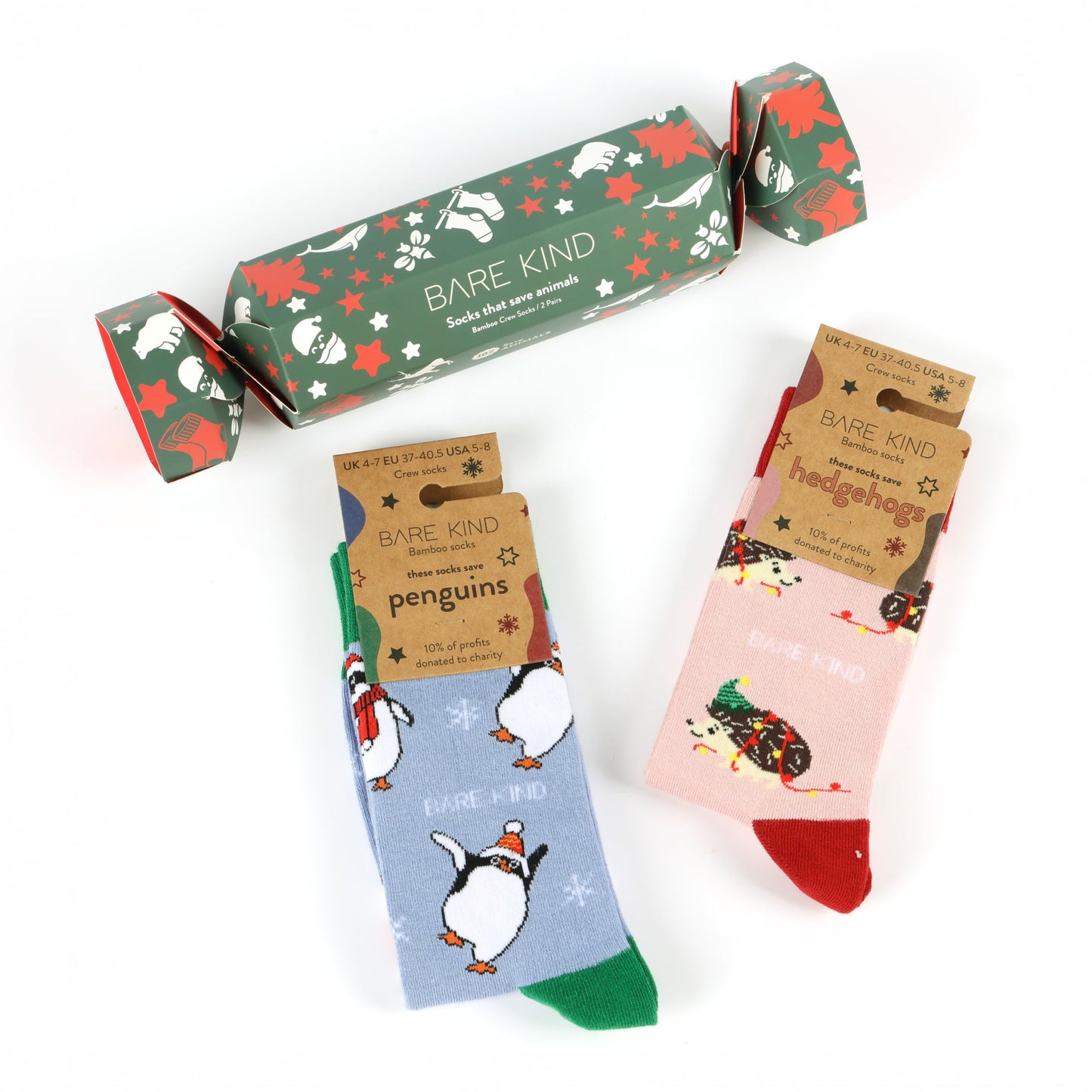 christmas crackers which includes blue green penguins and pink red hedgehogs bamboo socks