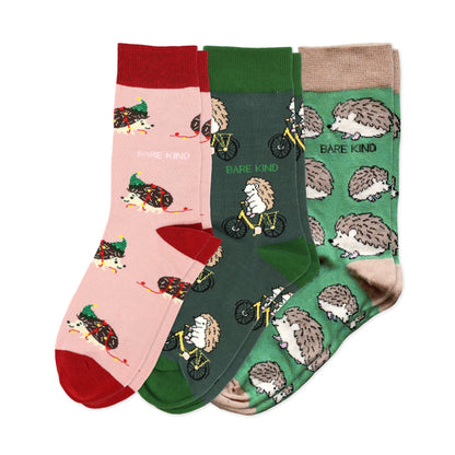 flat lays of pink christmas hedgehog, green hedgehog sport, green hedgehog bamboo socks