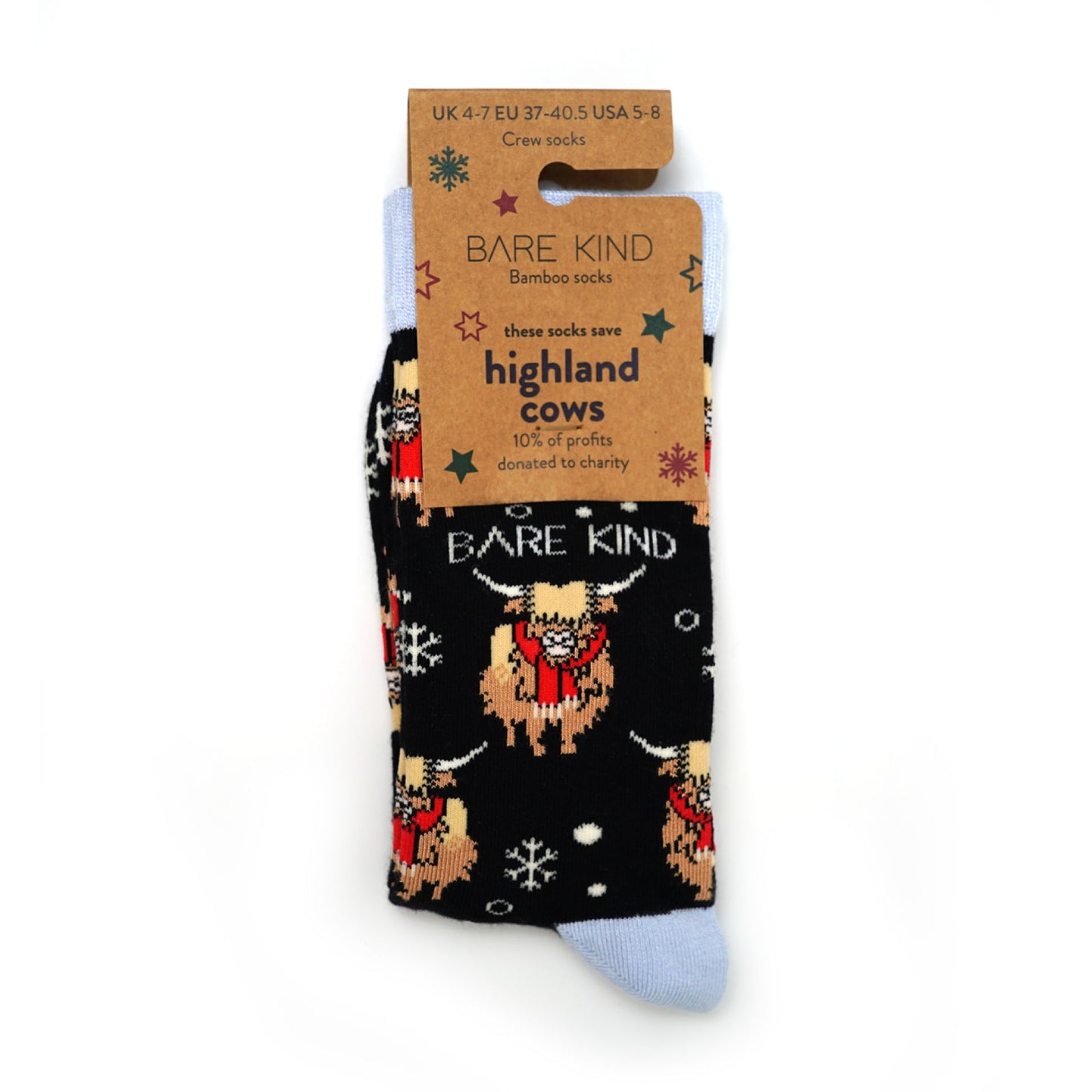 packaging flat lay of christmas highland cows bamboo socks