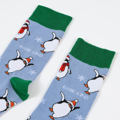 closeup to blue and green christmas penguin bamboo socks