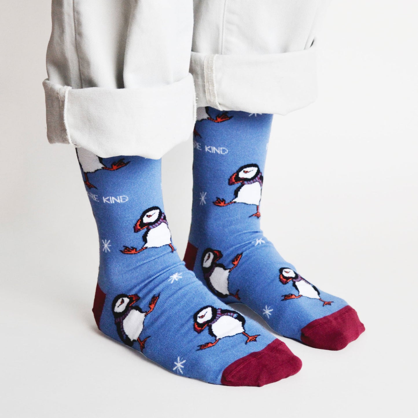 model wearing blue christmas puffin bamboo socks