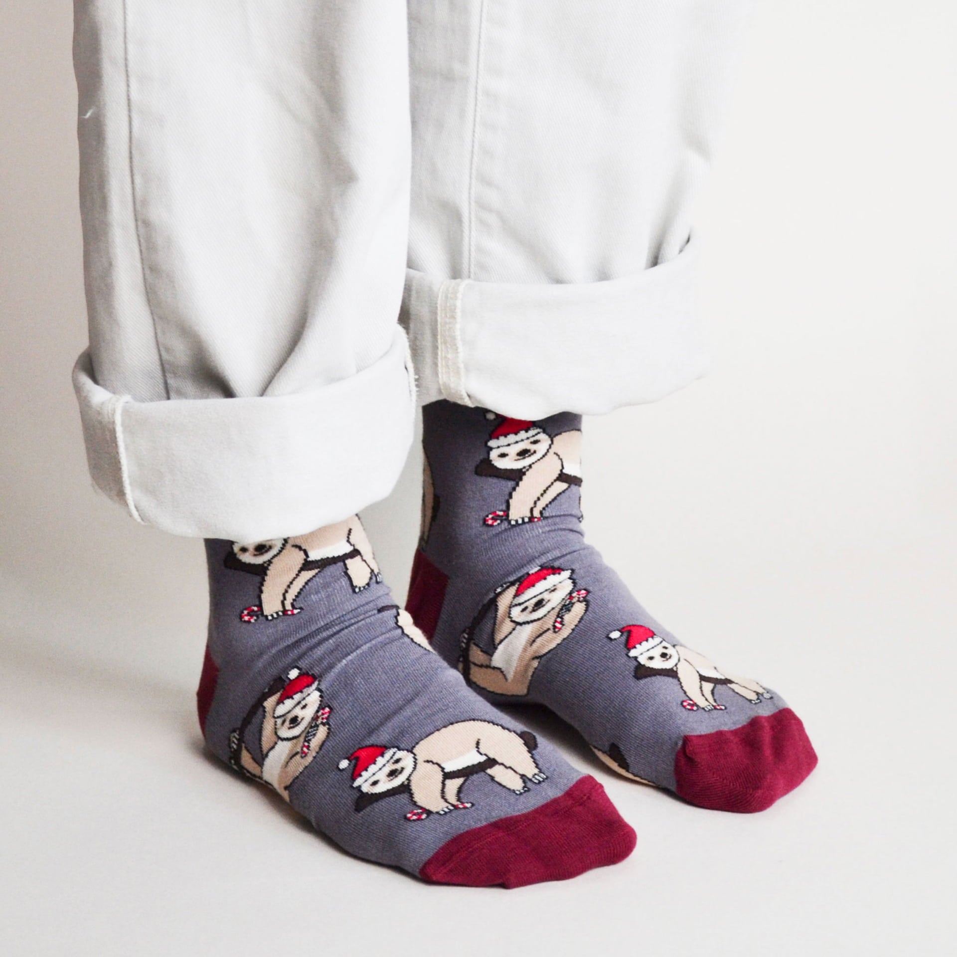 model wearing grey red christmas sloth bamboo socks