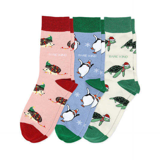 flat lays of christmas hedgehog, turtle and penguin bamboo socks