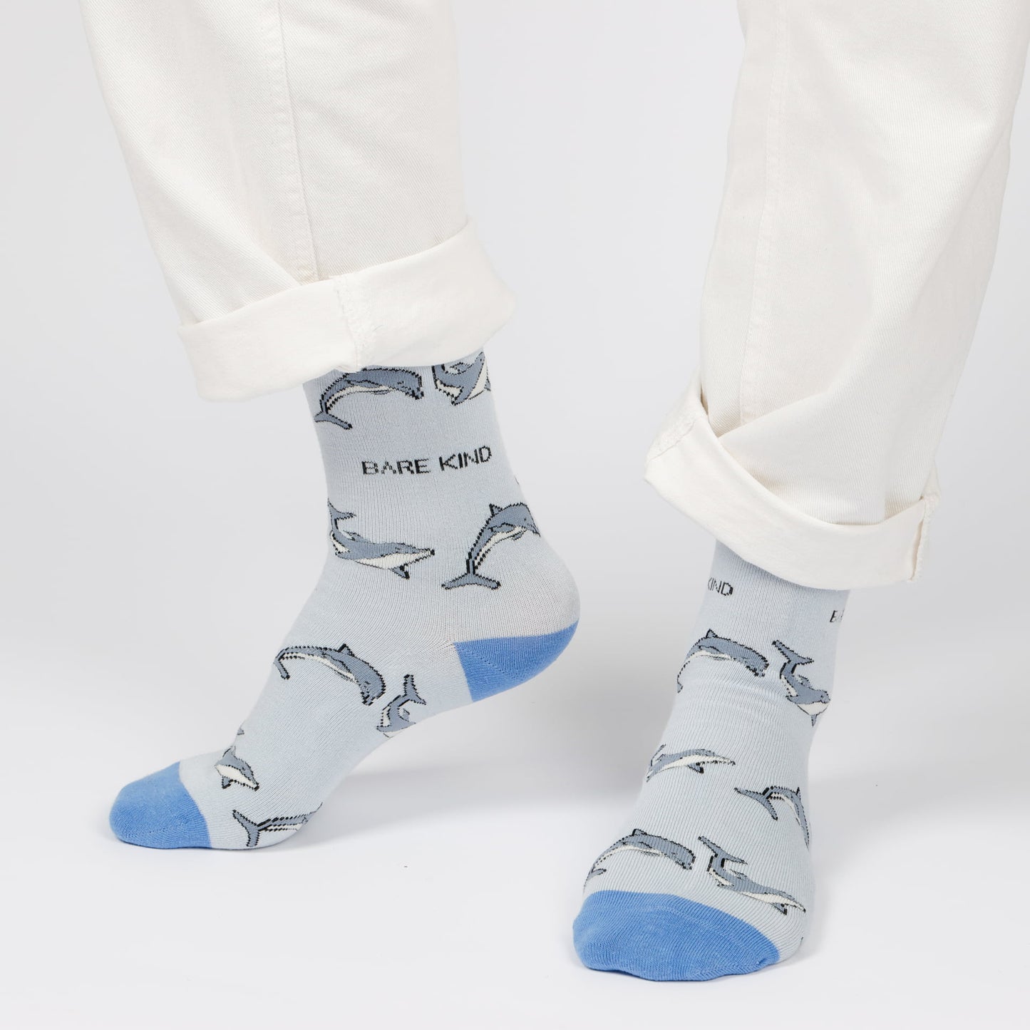 model wearing blue dolphin bamboo socks